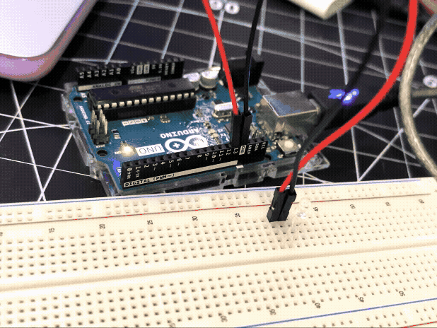 <b>Using a breadboard</b><br>Using the same Blink sketch, this time we inserted the LED into a breadboard, which we then connected to the Arduino using wires.