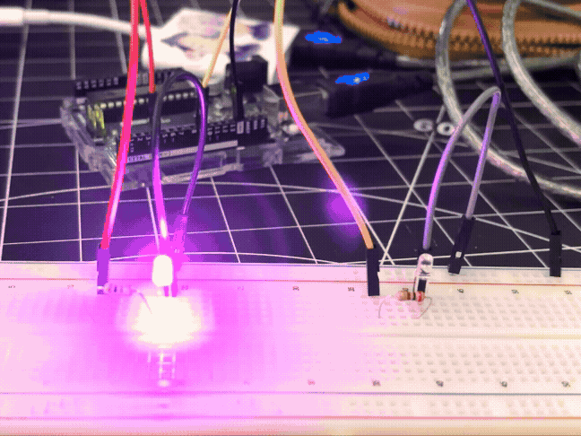 <b>Adding in an extra LED</b><br>We experimented further by adding in an extra set of LED, resistor, and wires. The code within the Blink sketch was modified to make the pink & green LEDs blink alternately (both have a 1-second delay between blinks).